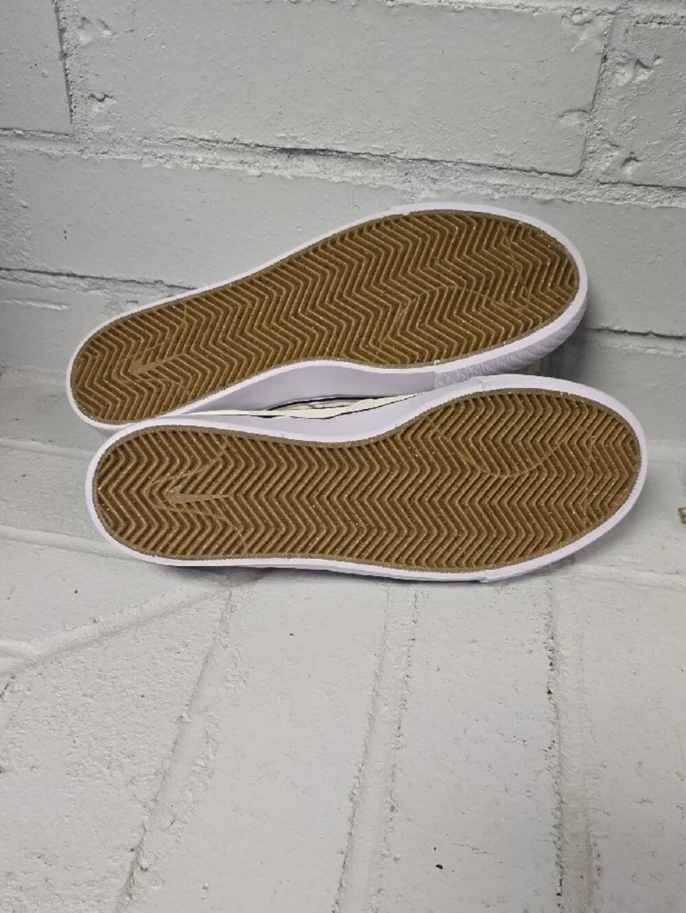 Nike Slip-On Sneakers in Off-White with Black Swoosh